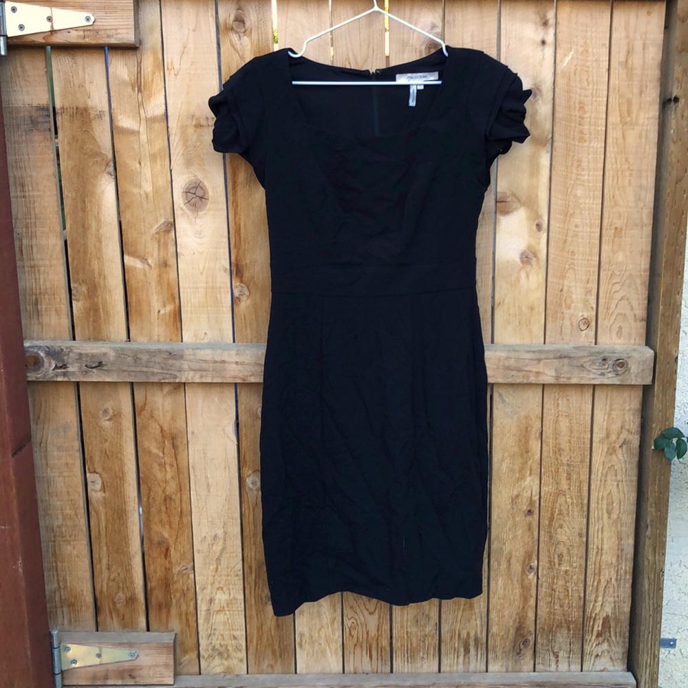 Little black dress with rose like shoulder detail